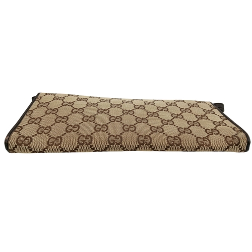 343 - A Gucci Monogram Bamboo Crossbody/Clutch Bag. Canvas exterior with leather trim, silver-toned hardwa... 
