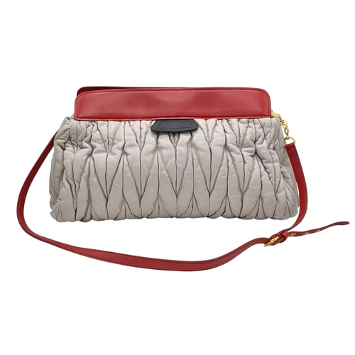 348 - A Miu Miu Matelassé Leather Shoulder Bag. Light purple leather exterior with gold-toned hardware, du... 