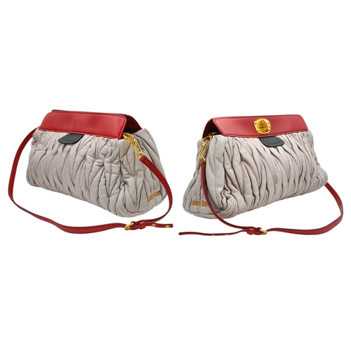 348 - A Miu Miu Matelassé Leather Shoulder Bag. Light purple leather exterior with gold-toned hardware, du... 