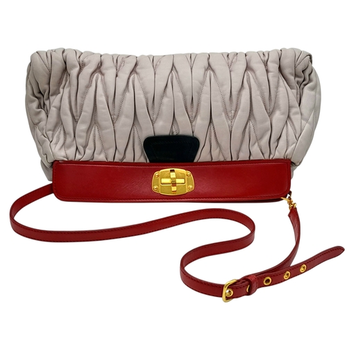 348 - A Miu Miu Matelassé Leather Shoulder Bag. Light purple leather exterior with gold-toned hardware, du... 