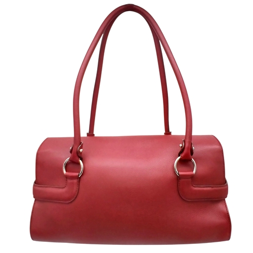 355 - A Salvatore Ferragamo Red Leather Handbag. Red leather exterior with silver-toned hardware, dual top... 