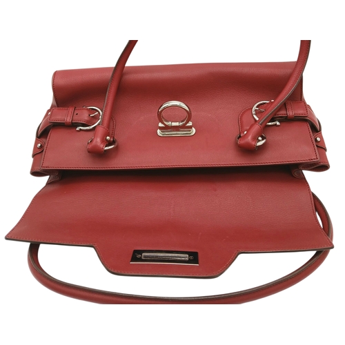 355 - A Salvatore Ferragamo Red Leather Handbag. Red leather exterior with silver-toned hardware, dual top... 