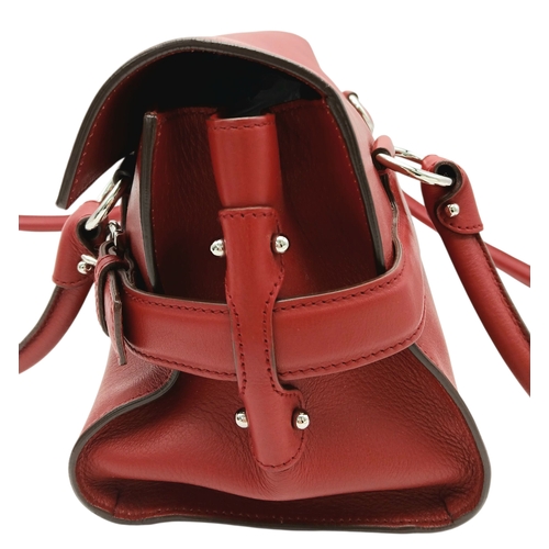 355 - A Salvatore Ferragamo Red Leather Handbag. Red leather exterior with silver-toned hardware, dual top... 