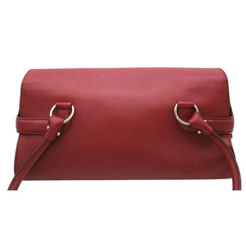 355 - A Salvatore Ferragamo Red Leather Handbag. Red leather exterior with silver-toned hardware, dual top... 