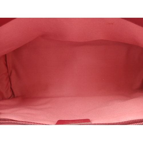 355 - A Salvatore Ferragamo Red Leather Handbag. Red leather exterior with silver-toned hardware, dual top... 