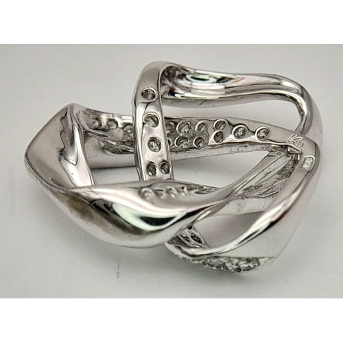 36 - AN 18K WHITE GOLD DIAMOND SET SWIRL DESIGN PENDANT. 0.28CTW, 2.8G TOTAL WEIGHT, 17mm x 18mm. Ref: SC... 