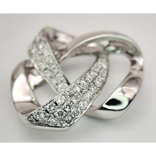 36 - AN 18K WHITE GOLD DIAMOND SET SWIRL DESIGN PENDANT. 0.28CTW, 2.8G TOTAL WEIGHT, 17mm x 18mm. Ref: SC... 