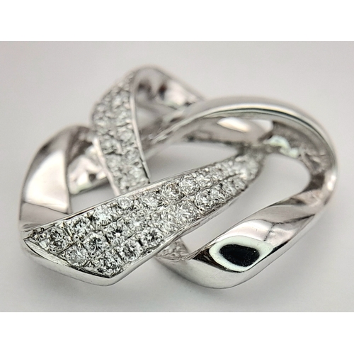 36 - AN 18K WHITE GOLD DIAMOND SET SWIRL DESIGN PENDANT. 0.28CTW, 2.8G TOTAL WEIGHT, 17mm x 18mm. Ref: SC... 