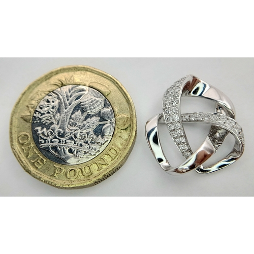 36 - AN 18K WHITE GOLD DIAMOND SET SWIRL DESIGN PENDANT. 0.28CTW, 2.8G TOTAL WEIGHT, 17mm x 18mm. Ref: SC... 