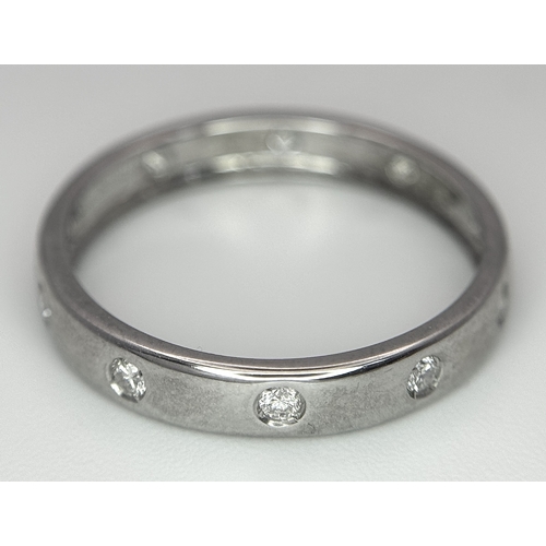 361 - AN 18K WHITE GOLD DIAMOND SET BAND RING. 1.7G TOTAL WEIGHT, SIZE L. Ref: SC 2087