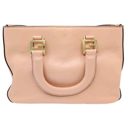 37 - A Fendi Pink Coated Tote Bag. Pink leather exterior with gold-toned hardware, dual top handles, a sn... 