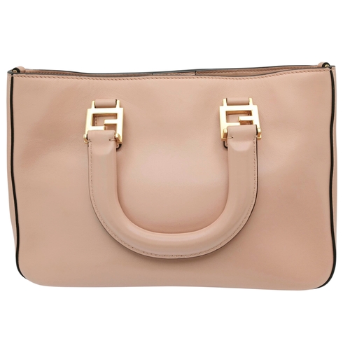 37 - A Fendi Pink Coated Tote Bag. Pink leather exterior with gold-toned hardware, dual top handles, a sn... 