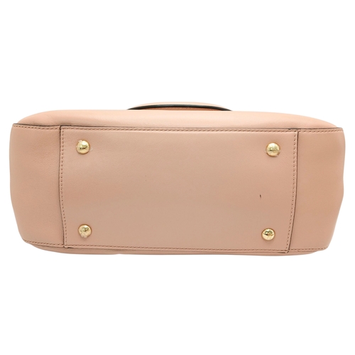 37 - A Fendi Pink Coated Tote Bag. Pink leather exterior with gold-toned hardware, dual top handles, a sn... 