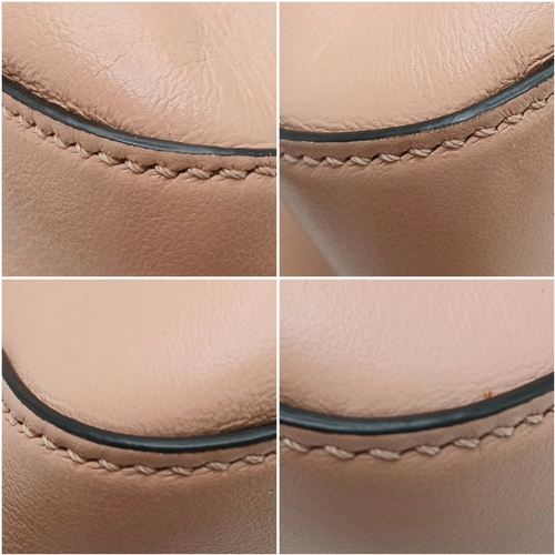 37 - A Fendi Pink Coated Tote Bag. Pink leather exterior with gold-toned hardware, dual top handles, a sn... 