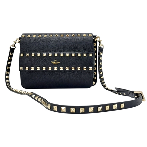 44 - A Valentino Garavani Black Rockstud Crossbody Bag. Black leather exterior with gold-tone hardware, d... 