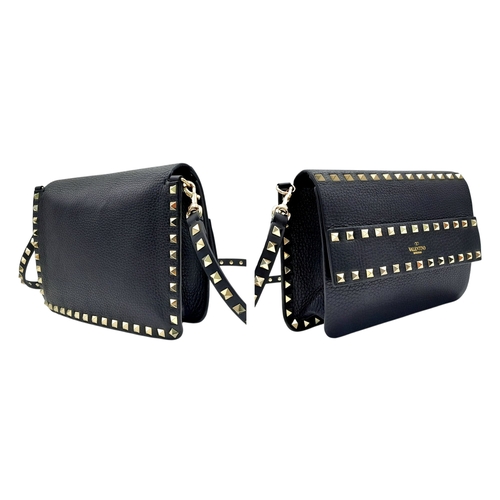 44 - A Valentino Garavani Black Rockstud Crossbody Bag. Black leather exterior with gold-tone hardware, d... 