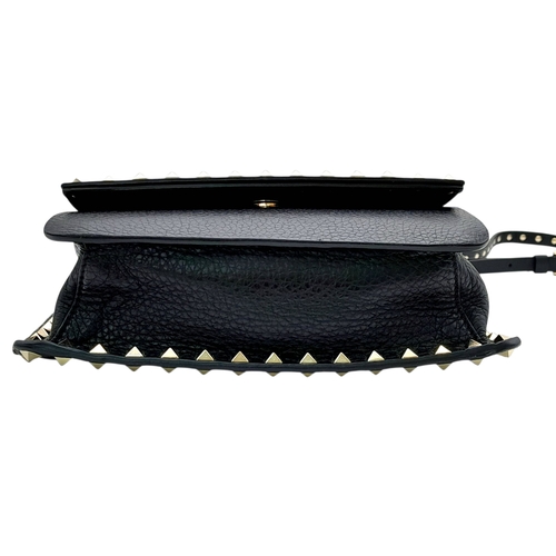44 - A Valentino Garavani Black Rockstud Crossbody Bag. Black leather exterior with gold-tone hardware, d... 