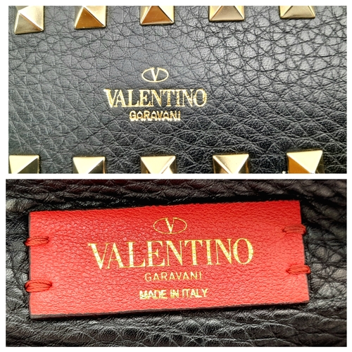 44 - A Valentino Garavani Black Rockstud Crossbody Bag. Black leather exterior with gold-tone hardware, d... 