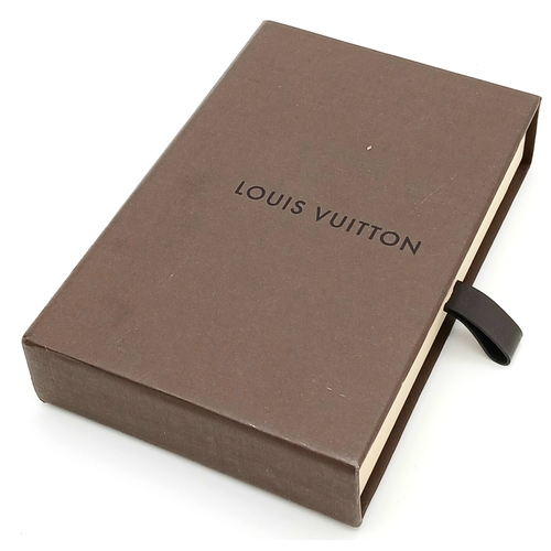 299 - A Louis Vuitton Red and Gold-Toned Monogram Flower Bag Holder. Gold-toned hardware with a red circul... 