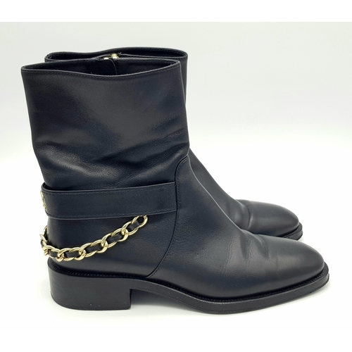 300 - A pair of Chanel Calfskin Chain High Boots. Size 38 1/2. Black leather exterior with round toes, sma... 