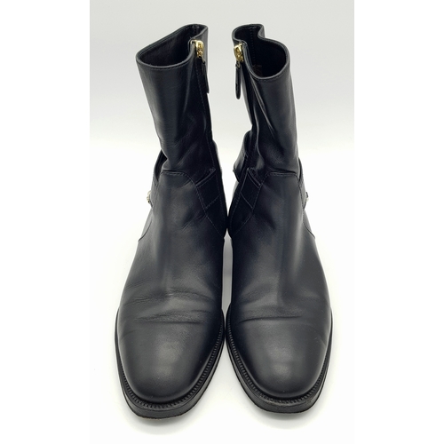 300 - A pair of Chanel Calfskin Chain High Boots. Size 38 1/2. Black leather exterior with round toes, sma... 