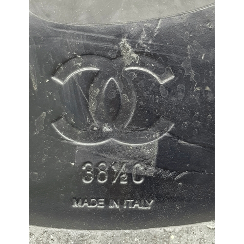 300 - A pair of Chanel Calfskin Chain High Boots. Size 38 1/2. Black leather exterior with round toes, sma... 