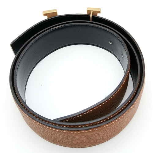 320 - A Hermès Reversible Leather Belt. Tan grained leather on one side, smooth black leather on the other... 