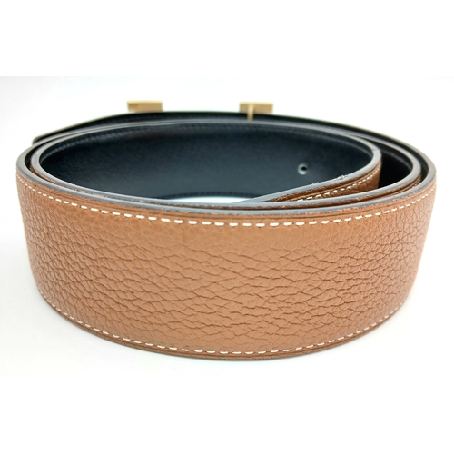 320 - A Hermès Reversible Leather Belt. Tan grained leather on one side, smooth black leather on the other... 