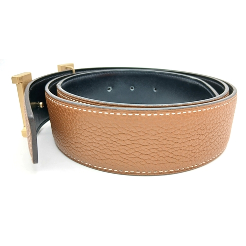 320 - A Hermès Reversible Leather Belt. Tan grained leather on one side, smooth black leather on the other... 