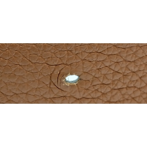 320 - A Hermès Reversible Leather Belt. Tan grained leather on one side, smooth black leather on the other... 