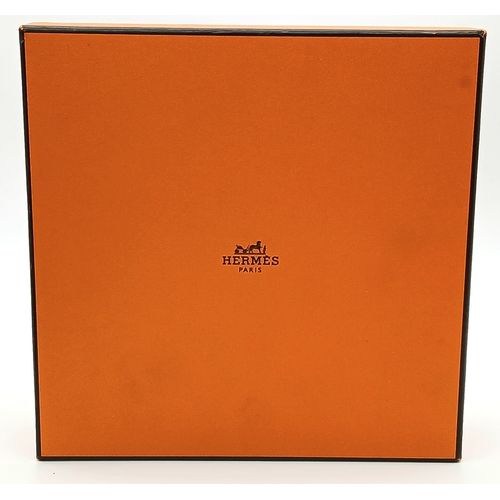 320 - A Hermès Reversible Leather Belt. Tan grained leather on one side, smooth black leather on the other... 