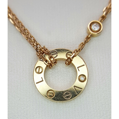 205 - A Bulgari 18K Gold Diamond Necklace and Pendant. Set with two round brilliant cut diamonds. Pendant ... 