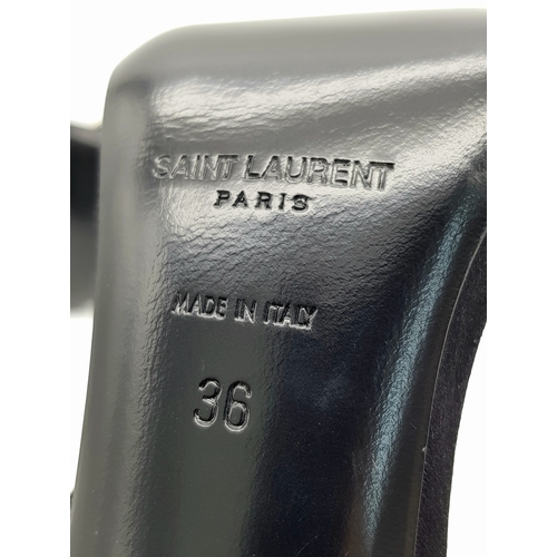 219 - A pair of Saint Laurent strappy heeled sandals. Black satin exterior with leather insoles, featuring... 