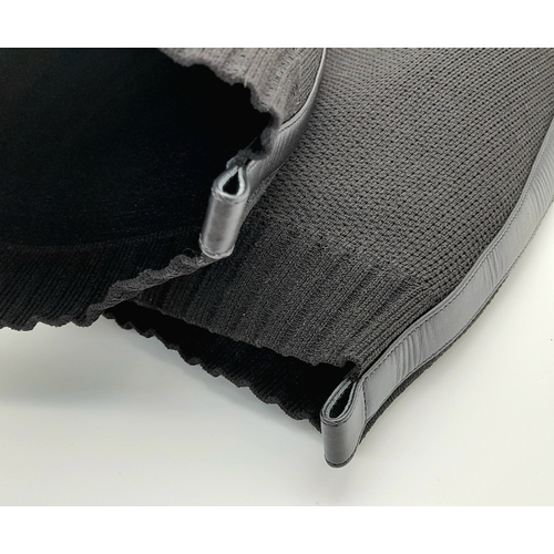 226 - A pair of Hermes knit calfskin Fontaine 60 Boots. size 35. Black knit exterior with leather accents ... 