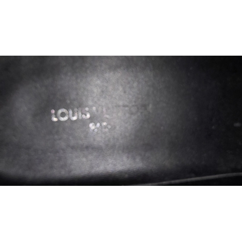 226 - A pair of Hermes knit calfskin Fontaine 60 Boots. size 35. Black knit exterior with leather accents ... 