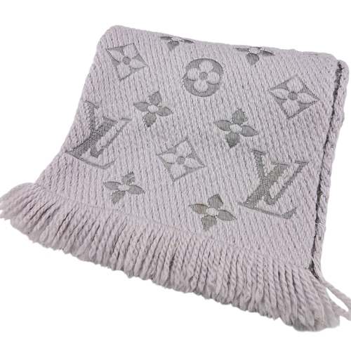 232 - A Louis Vuitton Wool Silk Logomania scarf in Pearl Grey with fringed edge. Size approx: 152.5cm x 31... 