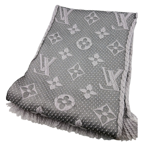 232 - A Louis Vuitton Wool Silk Logomania scarf in Pearl Grey with fringed edge. Size approx: 152.5cm x 31... 