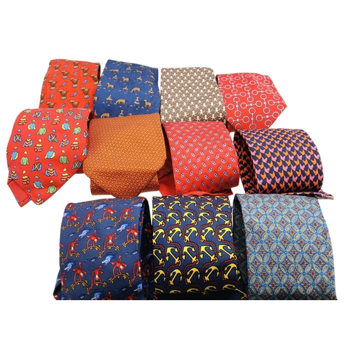 236 - Eleven Hermès Silk Ties. In good condition overall, one blue camel tie has a light stain - but pleas... 