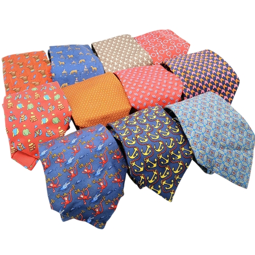 236 - Eleven Hermès Silk Ties. In good condition overall, one blue camel tie has a light stain - but pleas... 