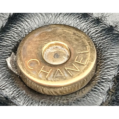 249 - A Chanel Dynasty Phone Holder Crossbody Bag. Black diamond-quilted lambskin leather exterior, gold-t... 