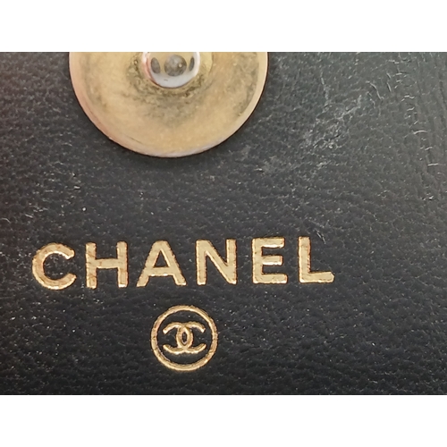 249 - A Chanel Dynasty Phone Holder Crossbody Bag. Black diamond-quilted lambskin leather exterior, gold-t... 