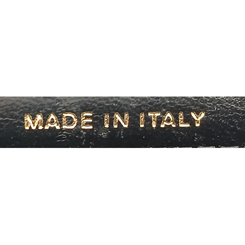 249 - A Chanel Dynasty Phone Holder Crossbody Bag. Black diamond-quilted lambskin leather exterior, gold-t... 