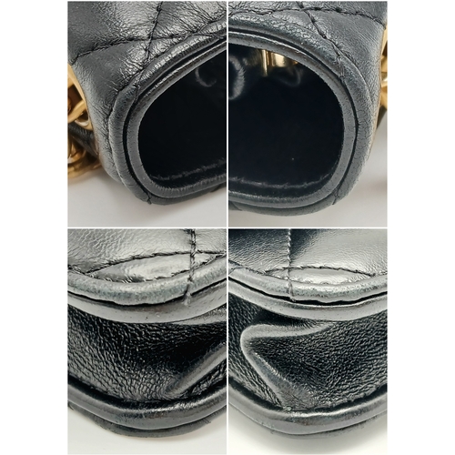 249 - A Chanel Dynasty Phone Holder Crossbody Bag. Black diamond-quilted lambskin leather exterior, gold-t... 