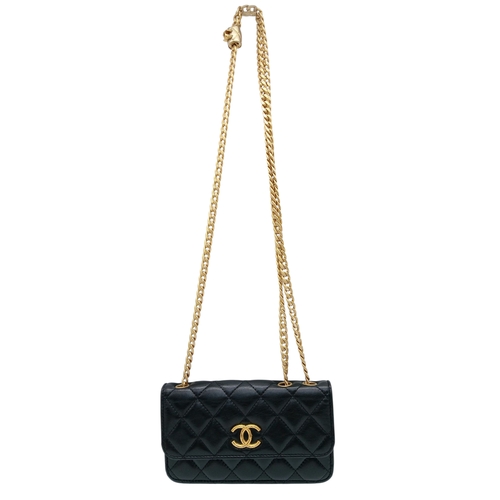 249 - A Chanel Dynasty Phone Holder Crossbody Bag. Black diamond-quilted lambskin leather exterior, gold-t... 