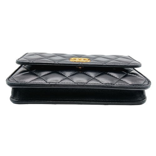 249 - A Chanel Dynasty Phone Holder Crossbody Bag. Black diamond-quilted lambskin leather exterior, gold-t... 