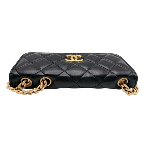 249 - A Chanel Dynasty Phone Holder Crossbody Bag. Black diamond-quilted lambskin leather exterior, gold-t... 