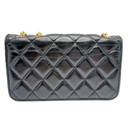249 - A Chanel Dynasty Phone Holder Crossbody Bag. Black diamond-quilted lambskin leather exterior, gold-t... 