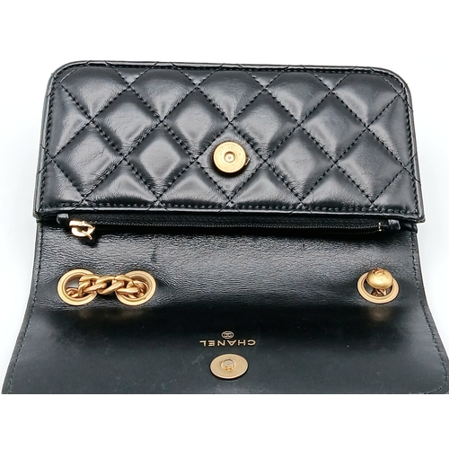 249 - A Chanel Dynasty Phone Holder Crossbody Bag. Black diamond-quilted lambskin leather exterior, gold-t... 