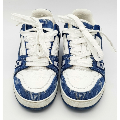 256 - A pair of Louis Vuitton embossed monogram denim sneakers. White leather and monogram denim exterior.... 