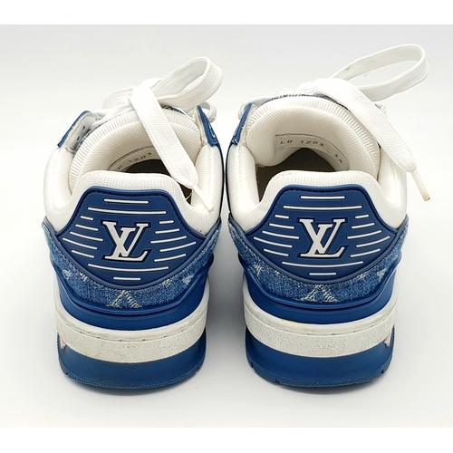 256 - A pair of Louis Vuitton embossed monogram denim sneakers. White leather and monogram denim exterior.... 